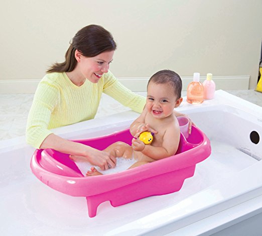 The First Years Sure Comfort Deluxe Newborn To Toddler Tub pink Toddler having bath