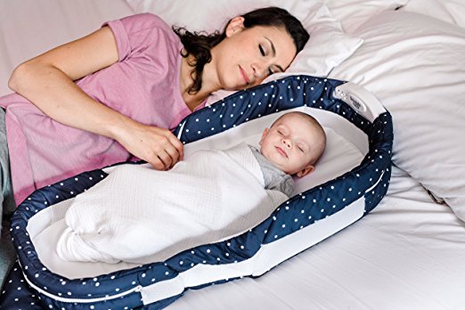 co-sleeper bassinet in bed with mom